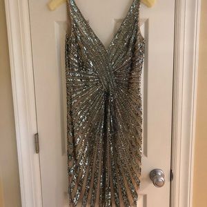 A nude with greenish blue beading cocktail dress.